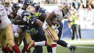 Sep 25, 2016; Seattle, WA, USA; San Francisco 49ers running back Carlos Hyde (28) scores a touchdown during the fourth quarter in a game against the Seattle Seahawks at CenturyLink Field. The Seahawks won 37-18. Mandatory Credit: Troy Wayrynen-USA TODAY Sports