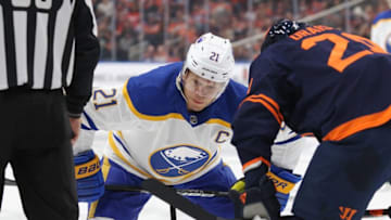 EDMONTON, CANADA OCTOBER 18: Kyle Okposo #21 of the Buffalo Sabres gets ready to take a face off against the Edmonton Oilers during a game on October 18, 2022 at Rogers Place in Edmonton, Alberta, Canada. (Photo by Lawrence Scott/Getty Images)