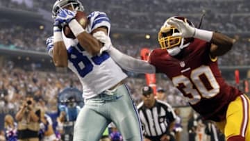 Oct 13, 2013; Arlington, TX, USA; Dallas Cowboys wide receiver Terrance Williams (83) catches a touchdown pass against Washington Redskins cornerback E.J. Biggers (30) in the third quarter of the game at AT