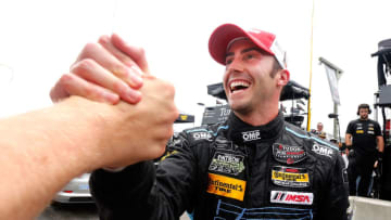 ALTON, VA - AUGUST 23: James Davison celebrates after winning the GTD pole position for the IMSA Tudor Series GT race at the Oak Tree Grand Prix at Virginia International Raceway on August 23, 2014 in Alton, Virginia. (Photo by Brian Cleary/Getty Images)
