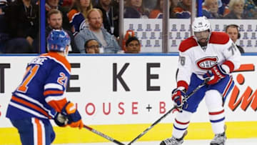 Oct 10, 2013; Edmonton, Alberta, CAN; Montreal Canadiens forward defenseman PK Subban (26) looks to make a pass against Edmonton Oilers defenseman Andrew Ference (21) at Rexall Place. Mandatory Credit: Perry Nelson-USA TODAY Sports