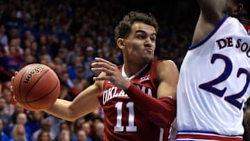 LAWRENCE, KS - FEBRUARY 19: Trae Young #11 of the Oklahoma Sooners looks to pass the ball against Silvio De Sousa #22 of the Kansas Jayhawks in the second half at Allen Fieldhouse on February 19, 2018 in Lawrence, Kansas. (Photo by Ed Zurga/Getty Images)