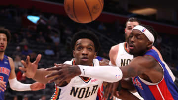 Herbert Jones #5 of the New Orleans Pelicans battles for a loose ball against Jerami Grant #9 of the Detroit Pistons (Photo by Gregory Shamus/Getty Images)