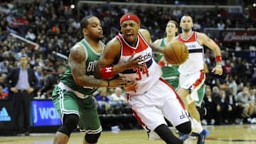 Dec 27, 2014; Washington, DC, USA; Washington Wizards forward Paul Pierce (34) dribbles as Boston Celtics guard Jameer Nelson (28) defends during the second half at Verizon Center. The Wizards won 101 - 88. Mandatory Credit: Brad Mills-USA TODAY Sports