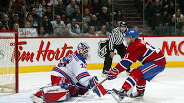 MONTREAL - FEBRUARY 19: Saku Koivu #11 of the Montreal Canadiens scores the winning goal against Henrik Lundqvist #30 of the New York Rangers in the shootout February 19, 2008 at the Bell Centre in Montreal, Quebec, Canada. The Rangers gave up a 5-0 lead to lose 6-5 during their NHL game. (Photo by Dave Sandford/NHLI via Getty Images)