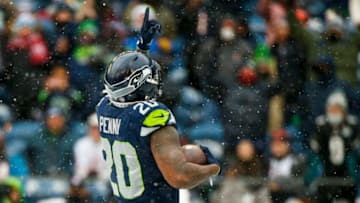 Dec 26, 2021; Seattle, Washington, USA; Seattle Seahawks running back Rashaad Penny (20) celebrates after rushing for a touchdown against the Chicago Bears during the second quarter at Lumen Field. Mandatory Credit: Joe Nicholson-USA TODAY Sports