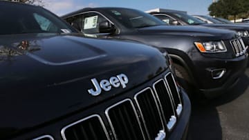 MIAMI, FL - APRIL 22: 2015 Jeep Grand Cherokee vehicles are seen on a sales lot as Fiat Chrysler Automobiles announced that it is recalling more than 1.1 million cars and SUVs worldwide because the vehicles may roll away after drivers exit the vehicles on April 22, 2016 in Miami, Florida. The recall covers the 2012-2014 Dodge Charger and Chrysler 300 sedans and 2014-2015 Jeep Grand Cherokee sport utility vehicles. (Photo by Joe Raedle/Getty Images)