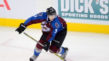 Jan 14, 2016; Denver, CO, USA; Colorado Avalanche defenseman Chris Bigras (3) controls the puck in the second period against the New Jersey Devils at the Pepsi Center. Mandatory Credit: Ron Chenoy-USA TODAY Sports