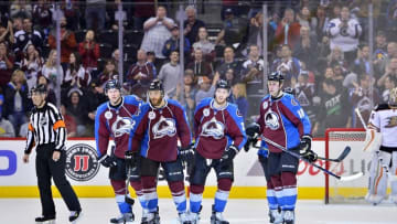 Apr 9, 2016; Denver, CO, USA; Colorado Avalanche defenseman Zach Redmond (22) following his goal skates back to center ice with defenseman Erik Johnson (6) and center Mikhail Grigorenko (25) and center Shawn Matthias (18) in the third period against the Anaheim Ducks at Pepsi Center. The Ducks defeated the Avalanche 5-3. Mandatory Credit: Ron Chenoy-USA TODAY Sports