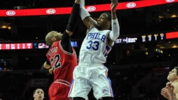 Jan 14, 2016; Philadelphia, PA, USA; Philadelphia 76ers forward Robert Covington (33) and Chicago Bulls forward Taj Gibson (22) battle for a jump ball during the fourth quarter of the game at the Wells Fargo Center. The Chicago Bulls won the game 115-111 in overtime. Mandatory Credit: John Geliebter-USA TODAY Sports