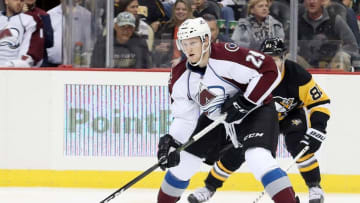 Oct 17, 2016; Pittsburgh, PA, USA; Colorado Avalanche center Nathan MacKinnon (29) skates with the puck ahead of Pittsburgh Penguins right wing Phil Kessel (81) during the second period at the PPG Paints Arena. Mandatory Credit: Charles LeClaire-USA TODAY Sports