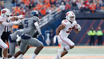 CHAMPAIGN, IL - OCTOBER 19: Jonathan Taylor #23 of the Wisconsin Badgers runs the ball against the Illinois Fighting Illini in the first half of the game at Memorial Stadium on October 19, 2019 in Champaign, Illinois. (Photo by Joe Robbins/Getty Images)
