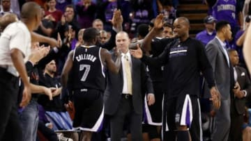 Nov 20, 2014; Sacramento, CA, USA; Sacramento Kings head coach Michael Malone celebrates with guard Darren Collison (7) as he takes him out of the game during the fourth quarter against the Chicago Bulls at Sleep Train Arena. The Sacramento Kings defeated the Chicago Bulls 103-88. Mandatory Credit: Kelley L Cox-USA TODAY Sports
