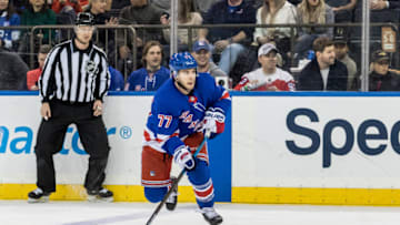 NEW YORK, NY - MARCH 03: New York Rangers Defenseman Tony DeAngelo (77) keeps the puck in the Capitals zone during a regular season NHL game between the Washington Capitals and the New York Rangers on March 03, 2019, at Madison Square Garden in New York, NY. (Photo by David Hahn/Icon Sportswire via Getty Images)