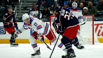COLUMBUS, OH - DECEMBER 5: Jesper Fast #17 of the New York Rangers attempts to steal the puck from Sonny Milano #22 of the Columbus Blue Jackets during the game on December 5, 2019 at Nationwide Arena in Columbus, Ohio. (Photo by Kirk Irwin/Getty Images)