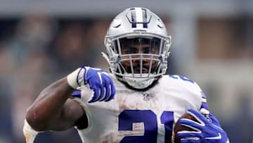 ARLINGTON, TX - SEPTEMBER 30: Ezekiel Elliott #21 of the Dallas Cowboys reacts after completing a pass against Jarrad Davis #40 of the Detroit Lions in the fourth quarter at AT&T Stadium on September 30, 2018 in Arlington, Texas. (Photo by Tom Pennington/Getty Images)