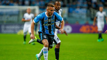 PORTO ALEGRE, BRAZIL - MAY 14: Arthur of Gremio, battles for the ball against Airton of Botafogo during the match Gremio v Botafogo as part of Brasileirao Series A 2017, at Arena do Gremio on May 14, 2017, in Porto Alegre, Brazil. (Photo by Lucas Uebel/Getty Images)