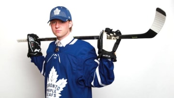 DALLAS, TX - JUNE 22: Rasmus Sandin poses after being selected twenty-ninth overall by the Toronto Maple Leafs during the first round of the 2018 NHL Draft at American Airlines Center on June 22, 2018 in Dallas, Texas. (Photo by Tom Pennington/Getty Images)