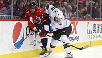 WASHINGTON, DC - JANUARY 22: Alex Ovechkin #8 of the Washington Capitals is checked by Tomas Hertl #48 of the San Jose Sharks during overtime at Capital One Arena on January 22, 2019 in Washington, DC. (Photo by Patrick Smith/Getty Images)