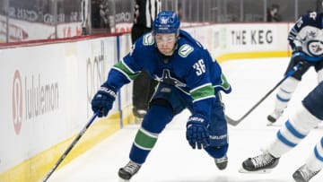 VANCOUVER, BC - MARCH 22: Nils Hoglander #36 of the Vancouver Canucks skates during NHL action against the Winnipeg Jets at Rogers Arena on March 22, 2021 in Vancouver, Canada. (Photo by Rich Lam/Getty Images)