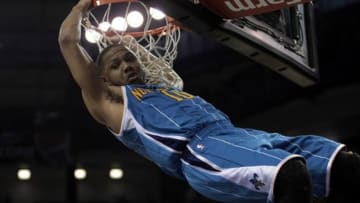 April 10, 2013; Sacramento, CA, USA; New Orleans Hornets shooting guard Eric Gordon (10) dunks the ball against the Sacramento Kings during the third quarter at Sleep Train Arena. The Sacramento Kings defeated the New Orleans Hornets 121-110. Mandatory Credit: Kelley L Cox-USA TODAY Sports