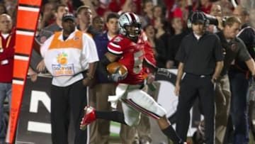 Jan 3, 2014; Miami Gardens, FL, USA; Ohio State Buckeyes quarterback Braxton Miller (5) runs for a touchdown during the first half in the 2014 Orange Bowl college football game against the Clemson Tigers at Sun Life Stadium. Mandatory Credit: Joshua S. Kelly-USA TODAY Sports
