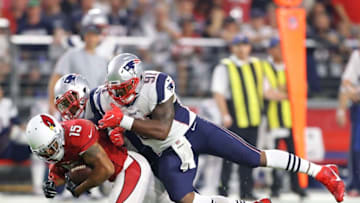 Sep 11, 2016; Glendale, AZ, USA; New England Patriots linebacker Jamie Collins (91) tackles Arizona Cardinals wide receiver Michael Floyd (15) at University of Phoenix Stadium. The Patriots defeated the Cardinals 23-21. Mandatory Credit: Mark J. Rebilas-USA TODAY Sports