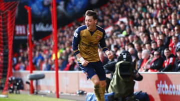 BOURNEMOUTH, ENGLAND - FEBRUARY 07: Mesut Oezil of Arsenal celebrates as he scores their first goal during the Barclays Premier League match between A.F.C. Bournemouth and Arsenal at the Vitality Stadium on February 7, 2016 in Bournemouth, England. (Photo by Matthew Lewis/Getty Images)