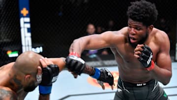 LAS VEGAS, NEVADA - JUNE 26: (R-L) Kennedy Nzechukwu of Nigeria punches Danilo Marques of Brazil in a light heavyweight fight during the UFC Fight Night event at UFC APEX on June 26, 2021 in Las Vegas, Nevada. (Photo by Chris Unger/Zuffa LLC)