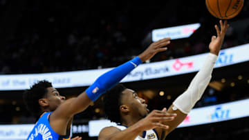 Shai Gilgeous-Alexander #2 of the OKC Thunder attempts to block Donovan Mitchell (Photo by Alex Goodlett/Getty Images)
