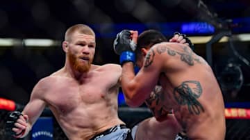 Jan 22, 2022; Anaheim, California, USA; Matt Frevola (red gloves) competes against Genaro Valdez (blue gloves) during UFC 270 at Honda Center. Mandatory Credit: Gary A. Vasquez-USA TODAY Sports