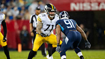 NASHVILLE, TN - AUGUST 25: Matt Feiler #71 of the Pittsburgh Steelers blocks Cameron Wake #91 of the Tennessee Titans during week three of preseason at Nissan Stadium on August 25, 2019 in Nashville, Tennessee. The Steelers defeated the Titans 18-6. (Photo by Wesley Hitt/Getty Images)