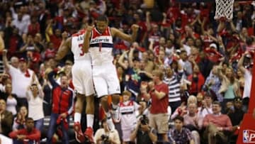 Apr 27, 2014; Washington, DC, USA; Washington Wizards forward Trevor Ariza (1) and Wizards guard Bradley Beal (3) celebrate in the closing seconds of the fourth quarter against the Chicago Bulls in game four of the first round of the 2014 NBA Playoffs at Verizon Center. The Wizards won 98-89. Mandatory Credit: Geoff Burke-USA TODAY Sports