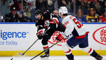 Feb 26, 2023; Buffalo, New York, USA; Buffalo Sabres center Vinnie Hinostroza (29) takes a shot on goal as Washington Capitals defenseman Erik Gustafsson (56) defends during the second period at KeyBank Center. Mandatory Credit: Timothy T. Ludwig-USA TODAY Sports