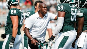Michigan State head coach Mel Tucker talks to offensive lineman Spencer Brown (58) at a timeout against Youngstown State during the second half at Spartan Stadium in East Lansing on Saturday, Sept. 11, 2021.