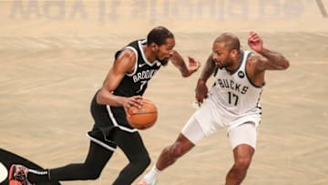 Former OKC Thunder stars shine - Nets forward Kevin Durant (7) controls the ball against Bucks forward P.J. Tucker (17): Wendell Cruz-USA TODAY Sports