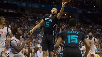 Mar 12, 2016; Charlotte, NC, USA; Charlotte Hornets forward Nicolas Batum (5) tries to tip a pass to guard Kemba Walker (15) in the first half against the Houston Rockets at Time Warner Cable Arena. Mandatory Credit: Jeremy Brevard-USA TODAY Sports