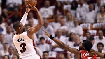 May 13, 2016; Miami, FL, USA; Miami Heat guard Dwyane Wade (3) shoots the ball over Toronto Raptors forward DeMarre Carroll (5) during the first quarter in game six of the second round of the NBA Playoffs at American Airlines Arena. Mandatory Credit: Steve Mitchell-USA TODAY Sports