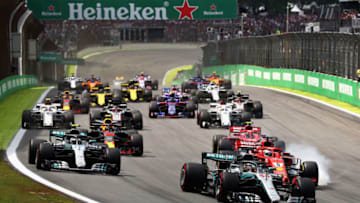 SAO PAULO, BRAZIL - NOVEMBER 11: Lewis Hamilton of Great Britain driving the (44) Mercedes AMG Petronas F1 Team Mercedes WO9 leads the field as Sebastian Vettel of Germany driving the (5) Scuderia Ferrari SF71H locks a wheel under braking during the Formula One Grand Prix of Brazil at Autodromo Jose Carlos Pace on November 11, 2018 in Sao Paulo, Brazil. (Photo by Mark Thompson/Getty Images)