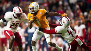 Tennessee wide receiver Velus Jones Jr. (1) fights off South Alabama inside linebacker Jamal Brooks (25) and South Alabama safety Tré Young (4) during a football game against South Alabama at Neyland Stadium in Knoxville, Tenn. on Saturday, Nov. 20, 2021.Kns Tennessee South Alabam Football Bp