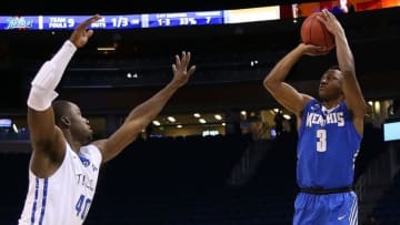 Mar 11, 2016; Orlando, FL, USA; Memphis Tigers guard Avery Woodson (3) takes a shot as Tulsa Golden Hurricane forward D'Andre Wright (40) defends in the first half during the AAC Tournament at the Amway Center. Mandatory Credit: Logan Bowles-USA TODAY Sports