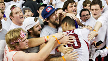 FAYETTEVILLE, AR - JANUARY 14: Rashad Madden #00 of the Arkansas Razorbacks celebrates with fans after an overtime win against the Kentucky Wildcats at Bud Walton Arena on January 14, 2014 in Fayetteville, Arkansas. The Razorbacks defeated the Wildcats 87-85. (Photo by Wesley Hitt/Getty Images)