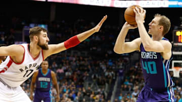 Nov 11, 2016; Charlotte, NC, USA; Charlotte Hornets forward Cody Zeller (40) shoots the ball against Toronto Raptors center Jonas Valanciunas (17) in the second half at Spectrum Center. The Raptors defeated the Hornets 113-111. Mandatory Credit: Jeremy Brevard-USA TODAY Sports