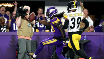 MINNEAPOLIS, MINNESOTA - DECEMBER 09: Dalvin Cook #33 of the Minnesota Vikings scores a touchdown against Minkah Fitzpatrick #39 of the Pittsburgh Steelers in the second quarter of the game at U.S. Bank Stadium on December 09, 2021 in Minneapolis, Minnesota. (Photo by David Berding/Getty Images)