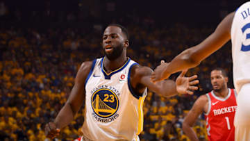 OAKLAND, CA - MAY 20: Draymond Green #23 of the Golden State Warriors high fives his teammate against the Houston Rockets in Game Three of the Western Conference Finals of the 2018 NBA Playoffs on May 20, 2018 at ORACLE Arena in Oakland, California. NOTE TO USER: User expressly acknowledges and agrees that, by downloading and or using this photograph, user is consenting to the terms and conditions of Getty Images License Agreement. Mandatory Copyright Notice: Copyright 2018 NBAE (Photo by Noah Graham/NBAE via Getty Images)
