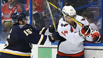 Apr 9, 2016; St. Louis, MO, USA; St. Louis Blues center Robby Fabbri (15) checks Washington Capitals right wing Justin Williams (14) during the second period at Scottrade Center. Mandatory Credit: Jasen Vinlove-USA TODAY Sports