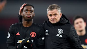 LONDON, ENGLAND - JANUARY 01: Ole Gunnar Solskjaer, Manager of Manchester United speaks to Aaron Wan-Bissaka of Manchester United after the Premier League match between Arsenal FC and Manchester United at Emirates Stadium on January 01, 2020 in London, United Kingdom. (Photo by Clive Mason/Getty Images)