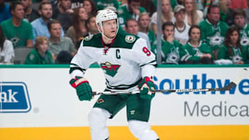 Apr 22, 2016; Dallas, TX, USA; Minnesota Wild center Mikko Koivu (9) skates against the Dallas Stars in game five of the first round of the 2016 Stanley Cup Playoffs at the American Airlines Center. The Wild defeat the Stars 5-4. Mandatory Credit: Jerome Miron-USA TODAY Sports