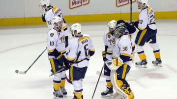 May 12, 2016; San Jose, CA, USA; Nashville Predators goalie Carter Hutton (30) is consoled by defenseman Shea Weber (6) and center Colton Sissons (10) after game seven of the second round of the 2016 Stanley Cup Playoffs at SAP Center. The San Jose Sharks defeat the Nashville Predators 5 to 0. Mandatory Credit: Neville E. Guard-USA TODAY Sports