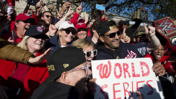 WASHINGTON, DC - NOVEMBER 02: Manager Dave Martinez #4 of the Washington Nationals celebrates with fans during a parade to celebrate the Washington Nationals World Series victory over the Houston Astros on November 2, 2019 in Washington, DC. This is the first World Series win for the Nationals in 95 years. (Photo by Patrick McDermott/Getty Images)